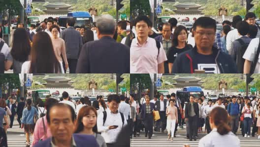 首尔，一群人在光华门广场的红绿灯上行走高清在线视频素材下载