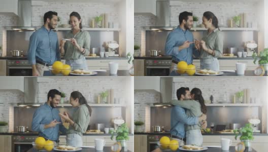 厨房里，美女向男友展示验孕结果。两个幸福的拥抱。高清在线视频素材下载