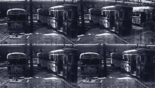 废弃的仓库，涂鸦覆盖了黑色和白色的电车高清在线视频素材下载