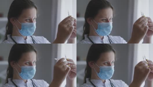 照片中的护士戴着冠状病毒口罩在室内检查药品安瓿。集中高加索年轻美丽的医生科学家寻找治疗新冠病毒大流行。高清在线视频素材下载