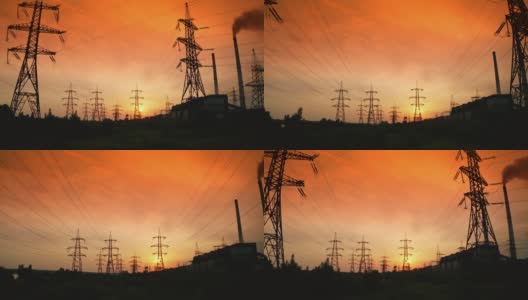 红色夜空下的输电线路。在美丽的日落下，电线与大自然中的高压电力塔。夕阳下的电线。高清在线视频素材下载