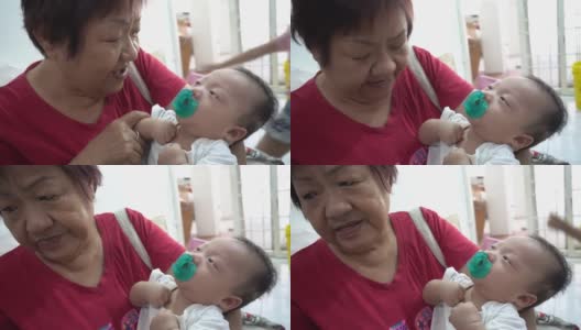 中国奶奶抱着男婴高清在线视频素材下载