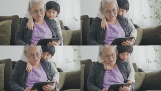 奶奶教孙子做作业。高清在线视频素材下载