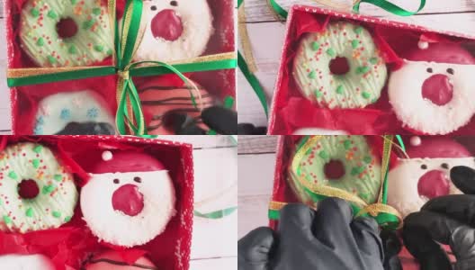 打开一个圣诞甜甜圈盒，甜甜圈上有糖霜和糖屑高清在线视频素材下载