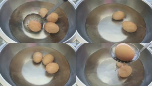 在平底锅里用热水煮鸡蛋。高清在线视频素材下载