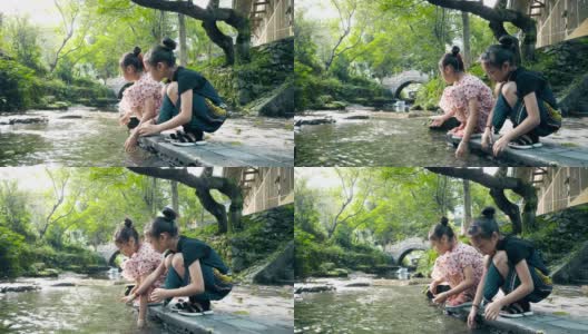 两个女孩在河边玩高清在线视频素材下载