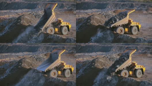 采石场上的自卸卡车卸载泥土高清在线视频素材下载