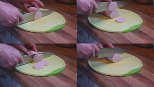 在厨房架子上的一块厨房板上，用锋利的刀子慢动作把香肠切成小块高清在线视频素材下载