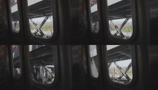 从纽约地铁的窗户看纽约市的建筑。穿过居民区的纽约地下高清在线视频素材下载