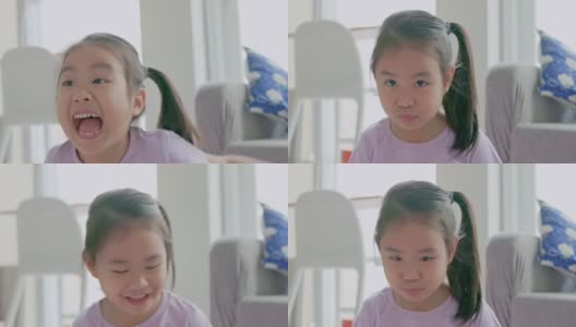 一个亚洲女孩的脸在微笑。高清在线视频素材下载
