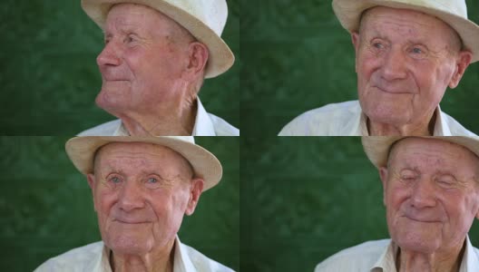 很有感情的老人肖像。爷爷开心地笑着。人像:年事已高，年事已高。一个沉思的老人在夏天独自坐在户外白色帽子的特写。慢动作高清在线视频素材下载