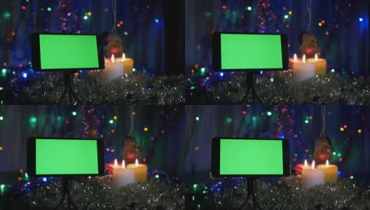 以新年为背景，绿色屏幕的智能手机。照相机围绕物体的运动。高清在线视频素材下载