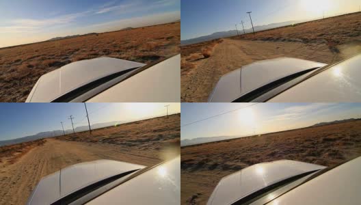汽车在沙漠中行驶。在沙漠道路上行驶时，摄像头安装在汽车天花板上高清在线视频素材下载