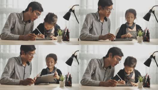 亚洲父亲解释家庭作业，帮助孩子在数字平板电脑高清在线视频素材下载