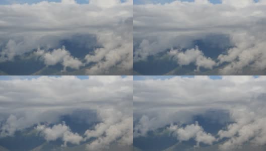4千片蓬松的云团翻滚在西藏的山顶和山谷，世界之巅。高清在线视频素材下载