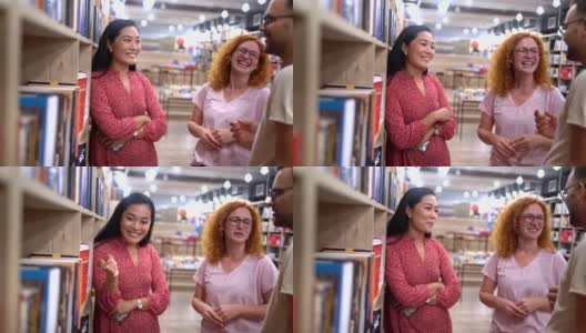 亚洲种族的女性图书管理员帮助顾客找到和选择的书高清在线视频素材下载