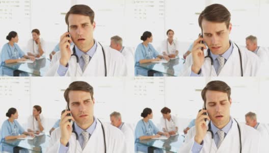 英俊的医生在打电话高清在线视频素材下载
