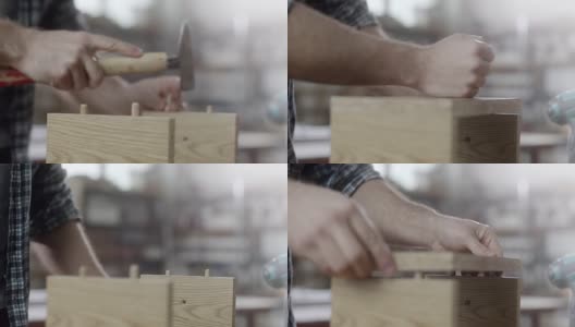特写，木匠用锤子组装家具高清在线视频素材下载