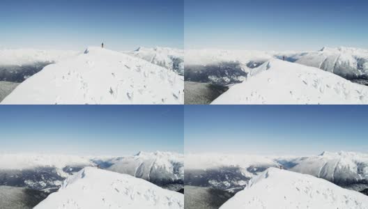 滑雪者站在4k雪山的顶端高清在线视频素材下载