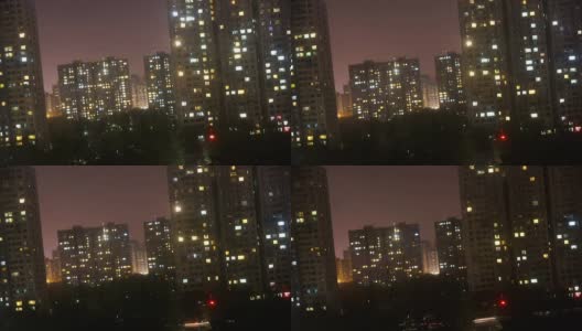 北京平果公寓的时间在夜间流逝高清在线视频素材下载