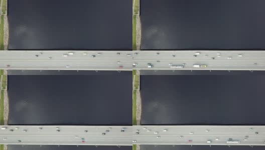 拉脱维亚里加的多加瓦河大桥上的汽车无人机俯视图观看4K超高清视频高清在线视频素材下载
