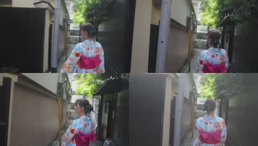 年轻女子在浴方走传统的日本狭窄的小路高清在线视频素材下载