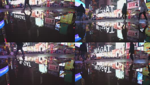 慢镜头:曼哈顿之夜，纽约时报广场的灯光在雨后的水坑中反射高清在线视频素材下载