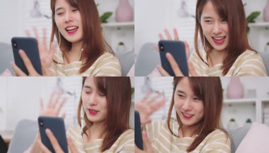 美丽的年轻亚洲女人做一个视频电话微笑和她的朋友和家人在家里交谈。高清在线视频素材下载