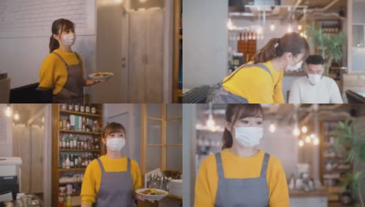 戴着防护面罩的服务员在café为顾客提供食物高清在线视频素材下载