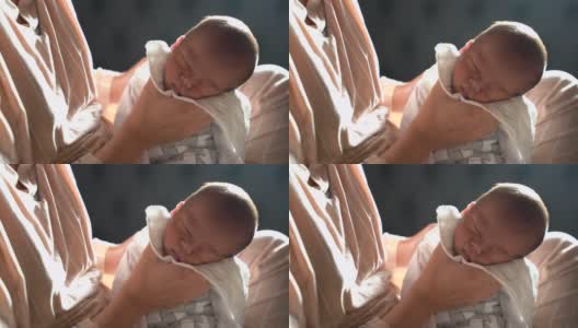 亚洲母亲给婴儿喂奶后打嗝高清在线视频素材下载