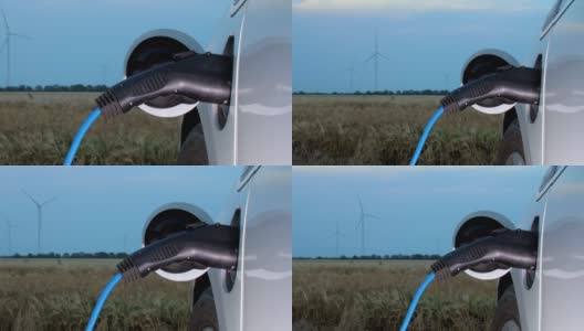 在农村地区使用风力发电机充电的电动汽车高清在线视频素材下载