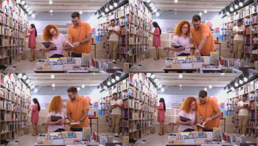 好奇的年轻夫妇在现代书店，为他们挑选书籍高清在线视频素材下载