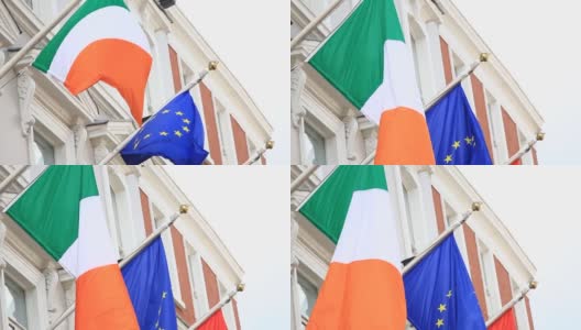 爱尔兰国旗和欧盟国旗在圣帕特里克节游行在都柏林高清在线视频素材下载