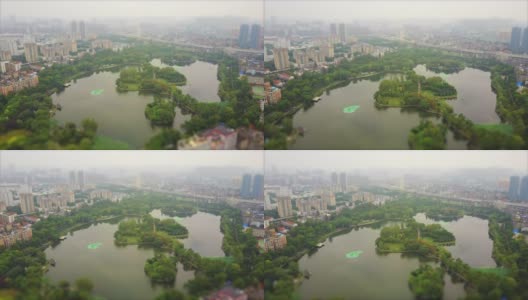 雾天武汉城市景观湖泊空中全景4k倾斜移位中国高清在线视频素材下载