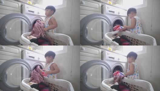亚洲男婴装衣服在家里的自动洗衣机洗衣服高清在线视频素材下载