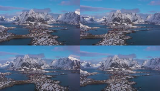 冬天里的村庄和山脉。Olstinden高峰。Moskenes,罗弗敦群岛。挪威的风景。鸟瞰图。无人机是轨道高清在线视频素材下载