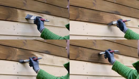 工人用棕色的木材漆房子外部保护颜色高清在线视频素材下载