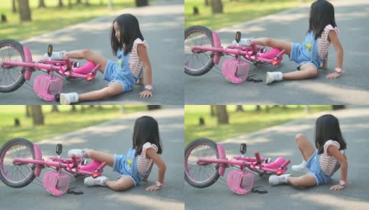 亚洲小女孩在花园里骑自行车高清在线视频素材下载