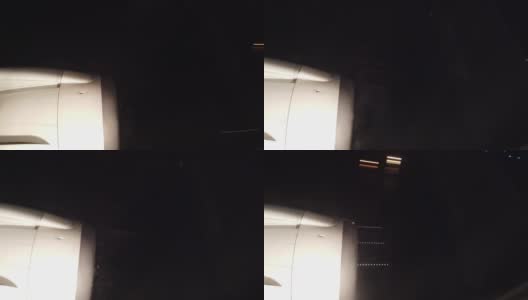 在晚上降落时从飞机窗口看到的景象高清在线视频素材下载