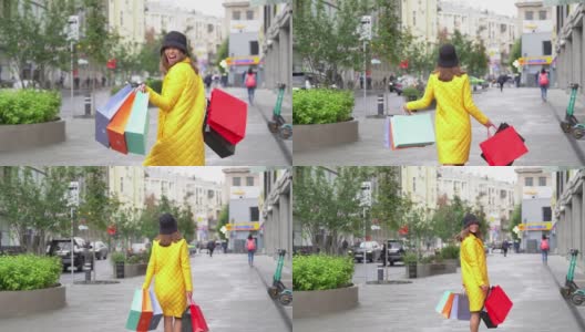 优雅的购物女在购物后走在城市的街道上。高清在线视频素材下载