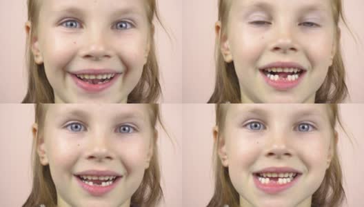一个小女孩的脸部特写，她露出了掉下来的乳牙，做鬼脸。高清在线视频素材下载
