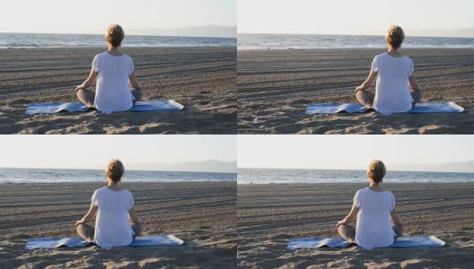 在海滩上做瑜伽的女人高清在线视频素材下载
