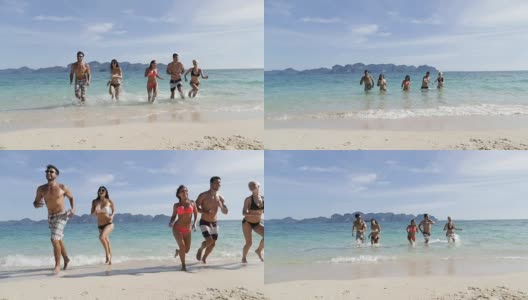 在海滩上，人们从水里跑出来，青年男女团体游客高清在线视频素材下载