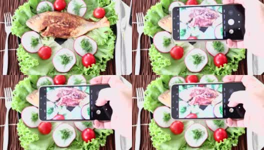 用智能手机抓拍烤鱼和新鲜蔬菜高清在线视频素材下载