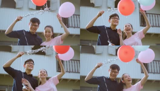 幸福的情侣在花园气球相爱，新年季节高清在线视频素材下载
