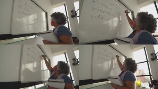 老师在黑板上写字，戴着口罩高清在线视频素材下载