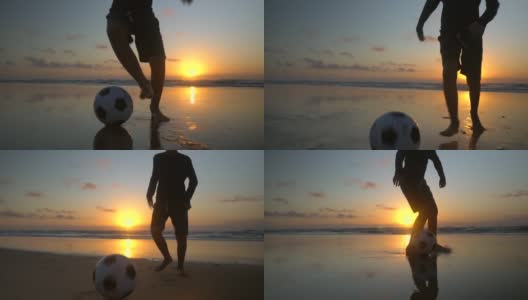 男孩在沙滩上玩球的剪影高清在线视频素材下载