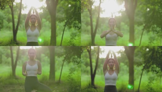 年轻的亚洲女人在花园里练习瑜伽。女性的幸福。模糊的背景。健康的生活方式和放松的观念。年轻的亚洲女孩在公园里做瑜伽。高清在线视频素材下载