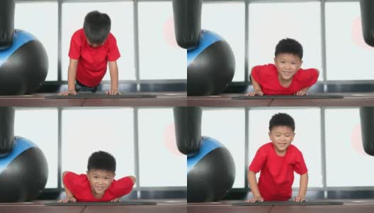 亚洲男孩在健身房做俯卧撑和瑜伽高清在线视频素材下载