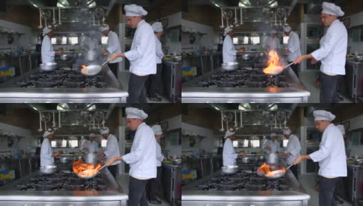 拉丁美洲的厨师在商业厨房烹饪，并在平底锅中烹制sautéing食物高清在线视频素材下载